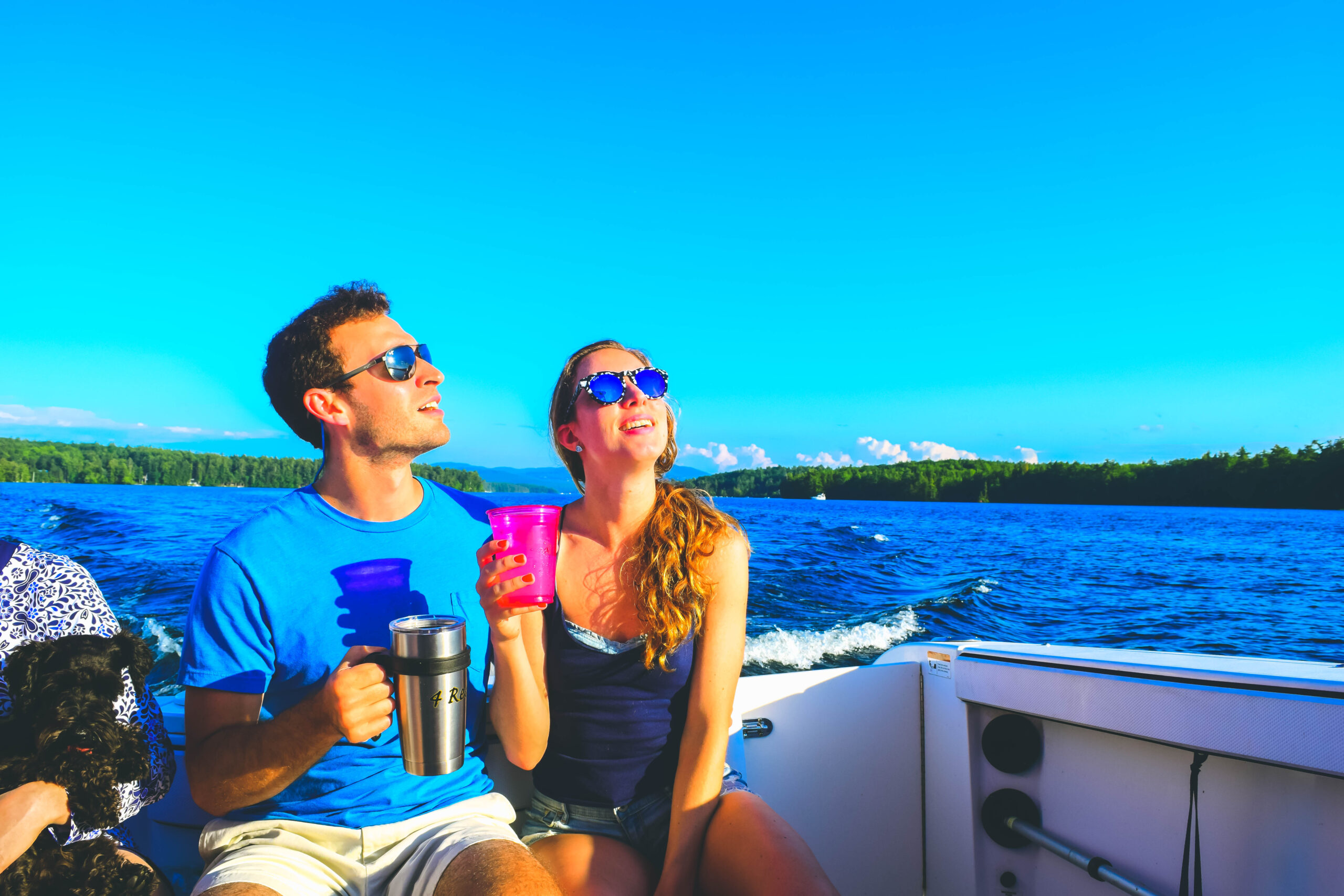 Lake Winnipesaukee_New Hampshire_Travel Guide_What to do_What to See_happy hour_boat_sunset_couple