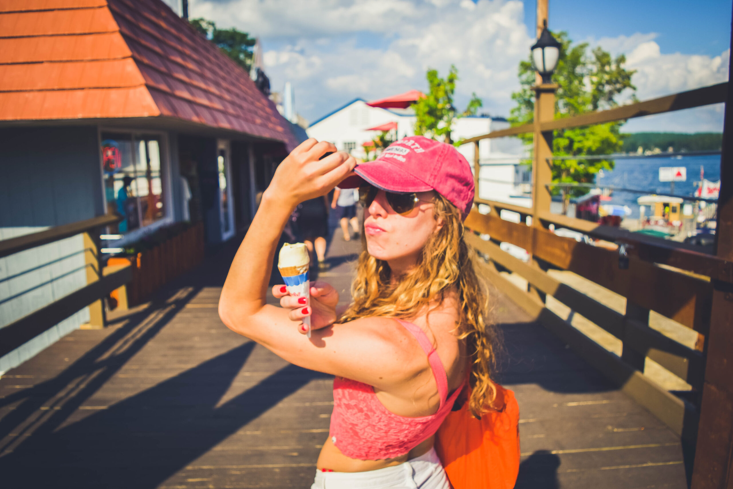 Lake Winnipesaukee_New Hampshire_Travel Guide_What to do_What to See_ice cream_jb scoops_vanilla sugar cone with chocolate sprinkles_summer treats on the lake_fashion_what to eat_dock_ pier