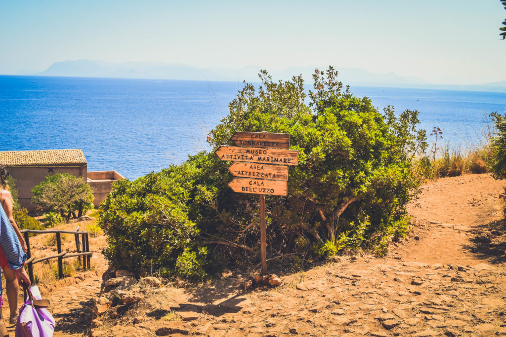 Travel Guide to Sicily_San vito lo capo_riserva dello zingaro_nature reserve_best beaches in italy_coves_where to go_boat_cala_signs