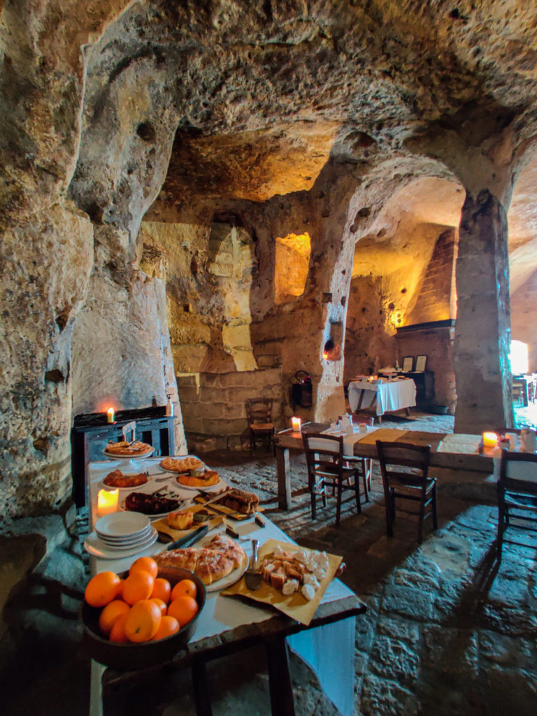 Sleep in Cave Hotel Sextianto Le Grotte della Civita in Matera, Basilicata travel guide where to stay travel blog svadore puglia road trip rock hewn church breakfast hotel sassi civita