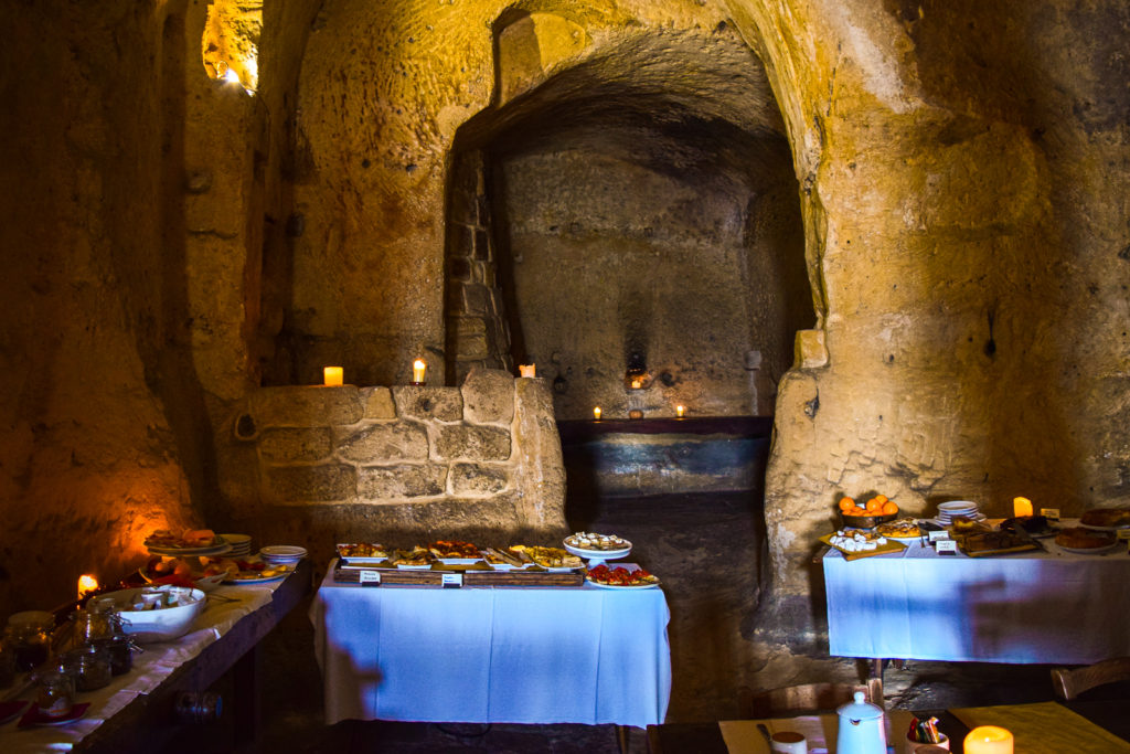 Sleep in Cave Hotel Sextianto Le Grotte della Civita in Matera, Basilicata travel guide where to stay travel blog svadore puglia road trip rock hewn church breakfast hotel sassi civita