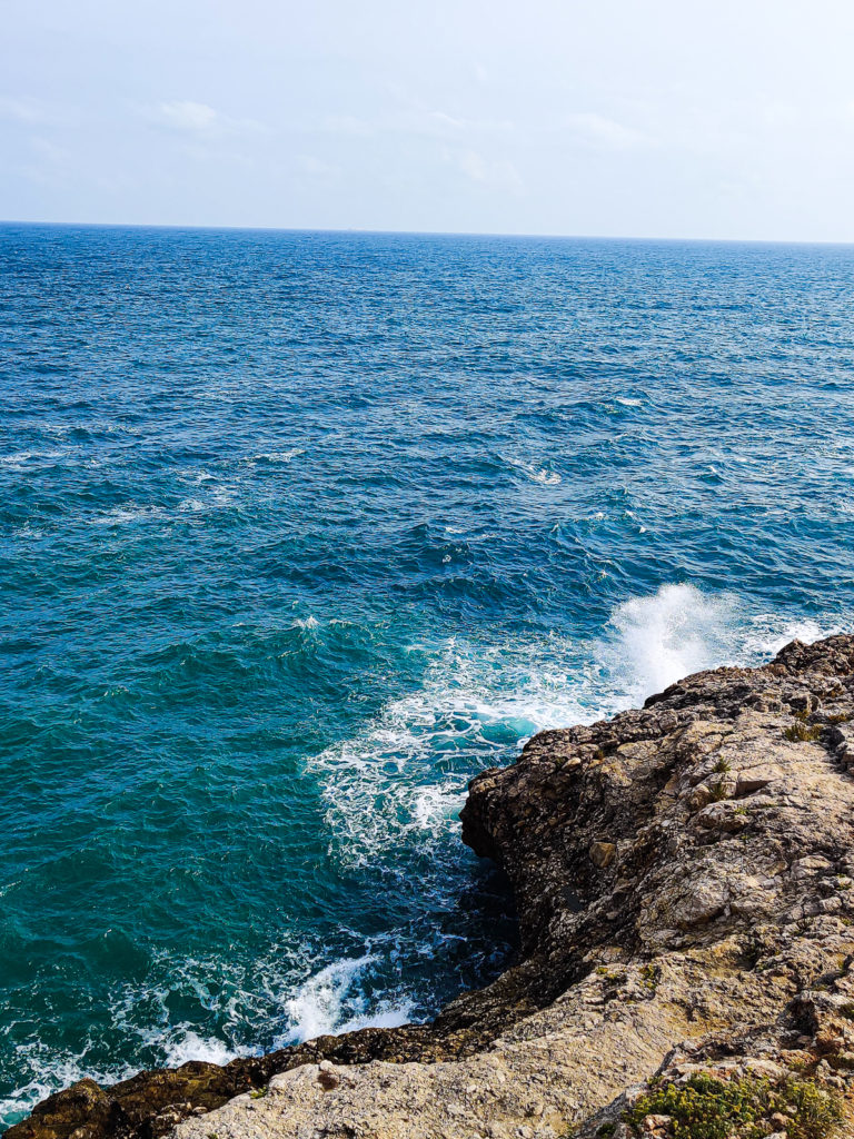 Essential Travel Guide to Polignano a Mare, Italy puglia svadore lido cala paura beach spiaggia