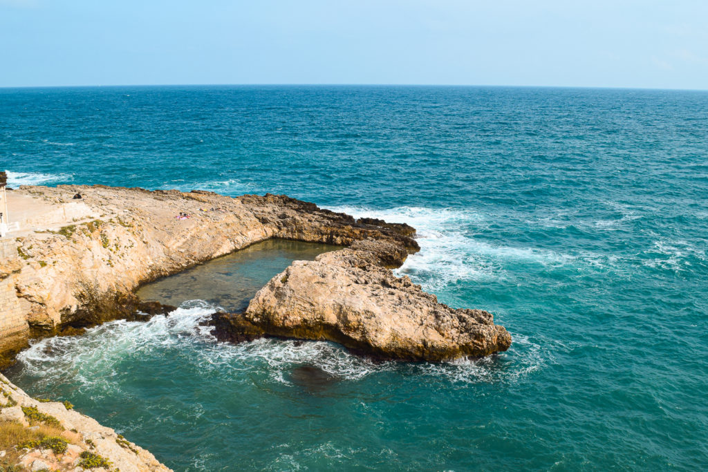 Essential Travel Guide to Polignano a Mare, Italy puglia svadore spiaggia beach grottone