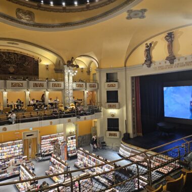 Interior of Giunti Odeon cinema bookstore in Florence showing 1920s Art Nouveau architecture and theater seating