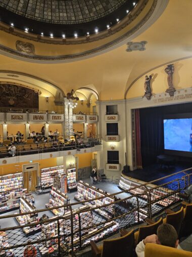 Interior of Giunti Odeon cinema bookstore in Florence showing 1920s Art Nouveau architecture and theater seating