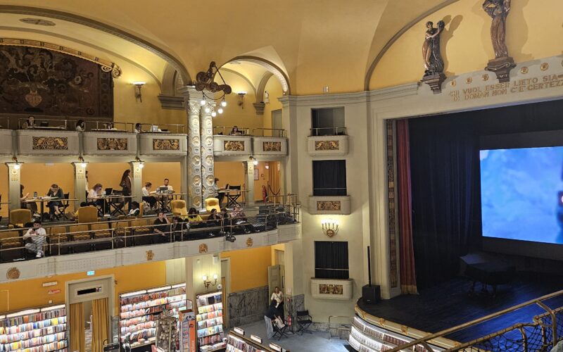 Interior of Giunti Odeon cinema bookstore in Florence showing 1920s Art Nouveau architecture and theater seating