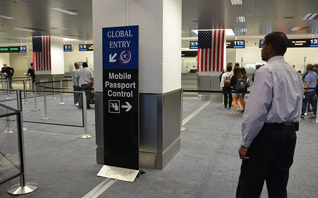 Smartphone screen showing the Mobile Passport Control MPC app, a top time-saving thing to know before visiting the USA.